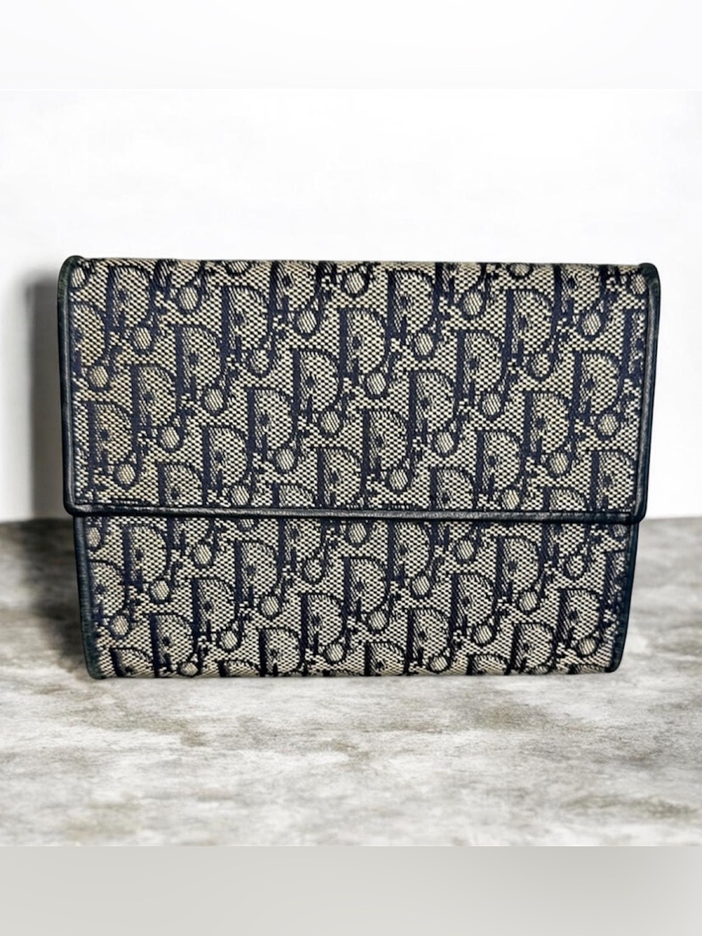 Christian Dior Oblique Jacquard wallet in navy/beige.
Retail price: ~$550–$750